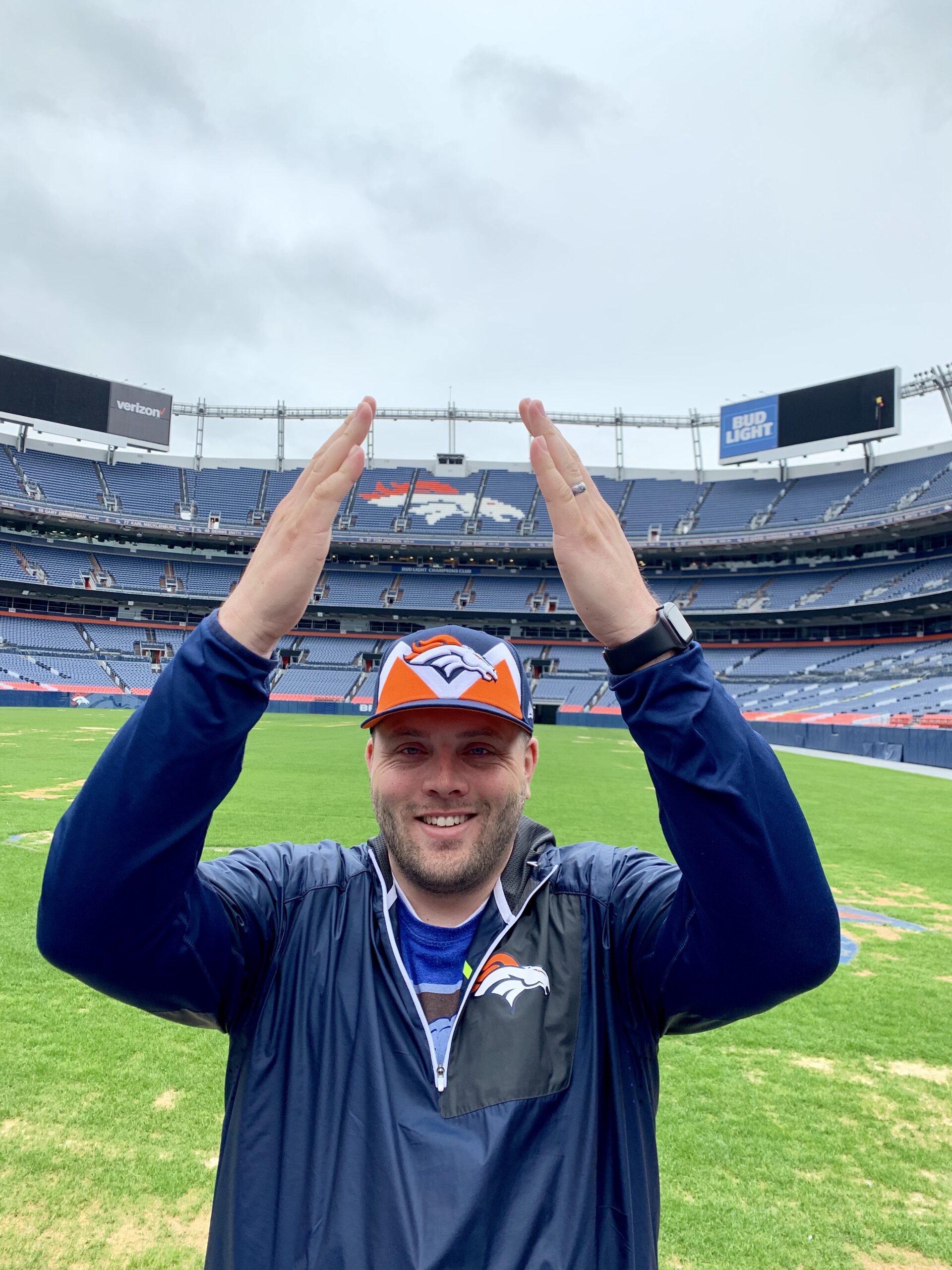 Garrett Pancheri, Denver Broncos fan, on the field at Empower Field