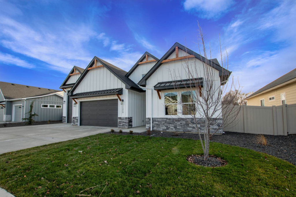 Front exterior of a newly built Treasure Valley home with a covered entry