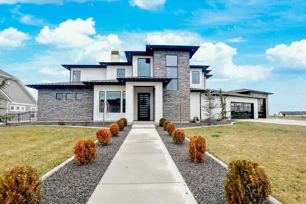 Front exterior of a modern Treasure Valley home with stone and stucco siding