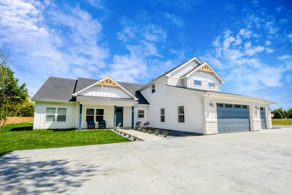 Front exterior of a Treasure Valley home with a wide driveway and open yard