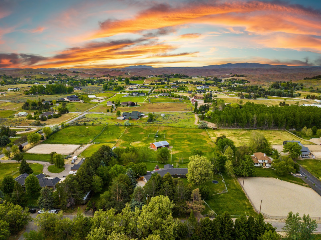 Aerial view of a single-family home and the surrounding neighborhood, the kind of property I price for buyers and sellers every month.
